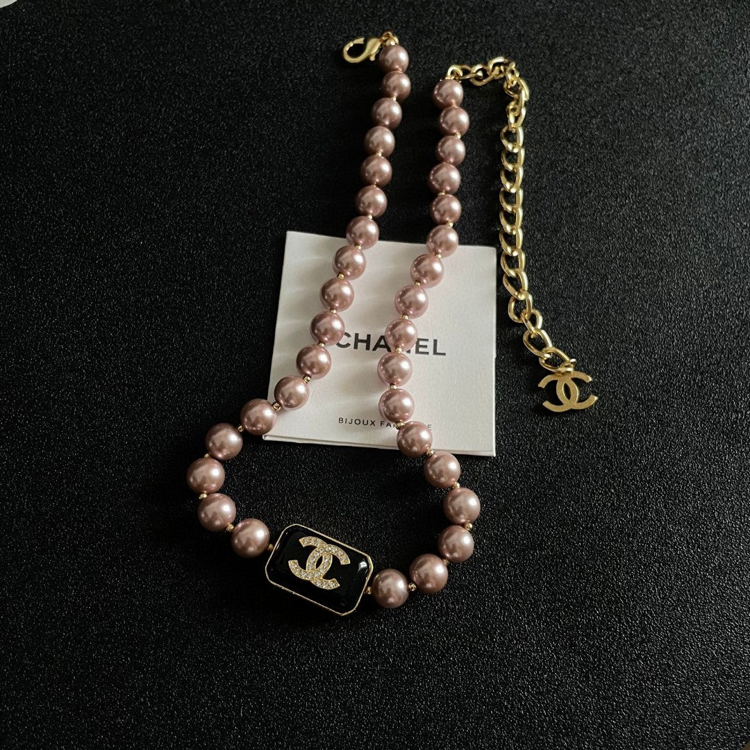 Double-C Emblem Pearl-Detail Pendant Necklace – Pearl Detail – Design 101 detail view