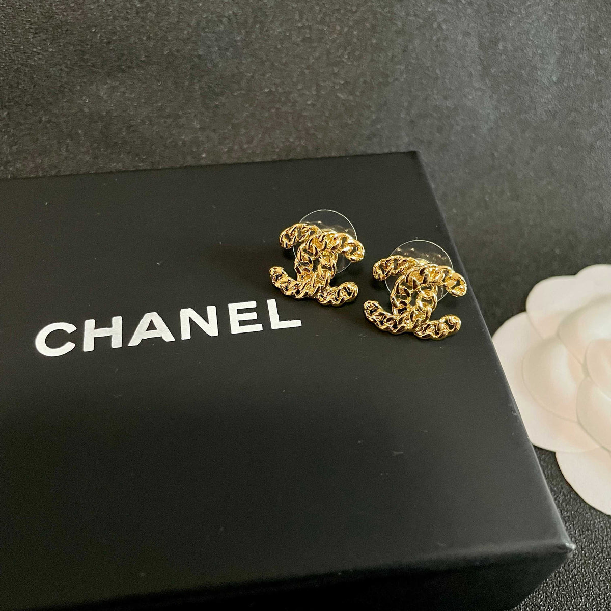 Double-C Emblem Stud Earrings in Polished Metal-Tone – Design 440 detail view