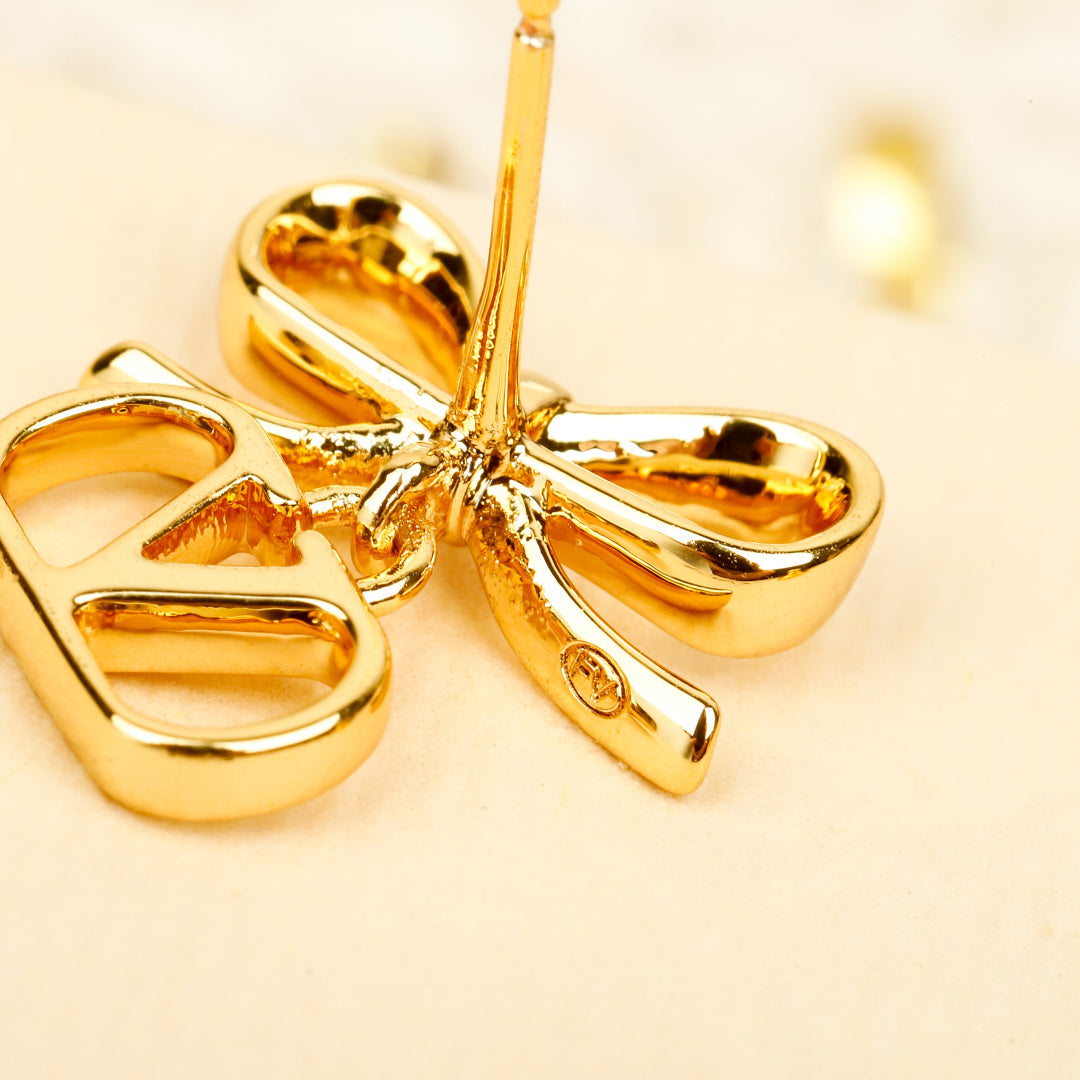Bow Statement Earrings in Polished Metal-Tone styled detail