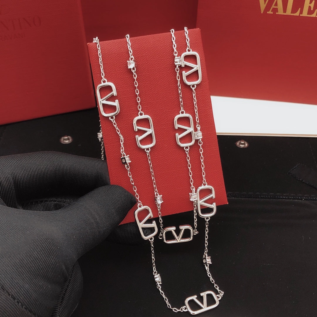 Signature Emblem Double-Layer Pendant Necklace styled detail