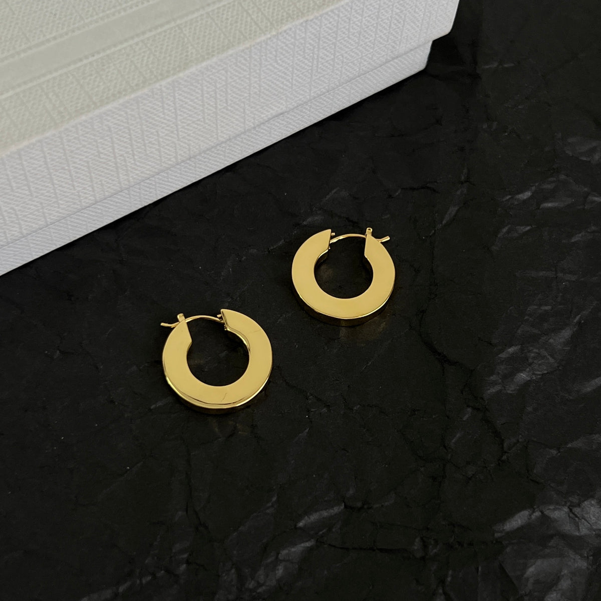 Signature Emblem Statement Earrings in Polished Metal-Tone – Design 01 styled detail