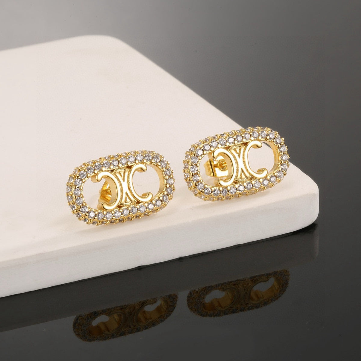 Signature Emblem Stud Earrings in Gold-Tone – Design 05 styled detail