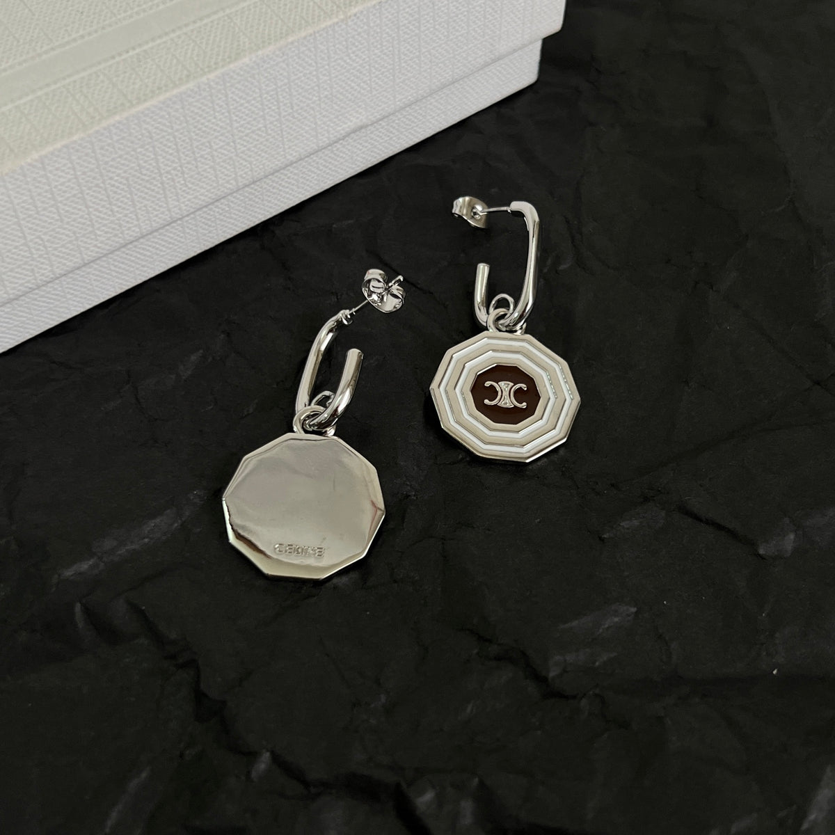 Signature Emblem Stud Earrings in Polished Metal-Tone – Design 02 styled detail