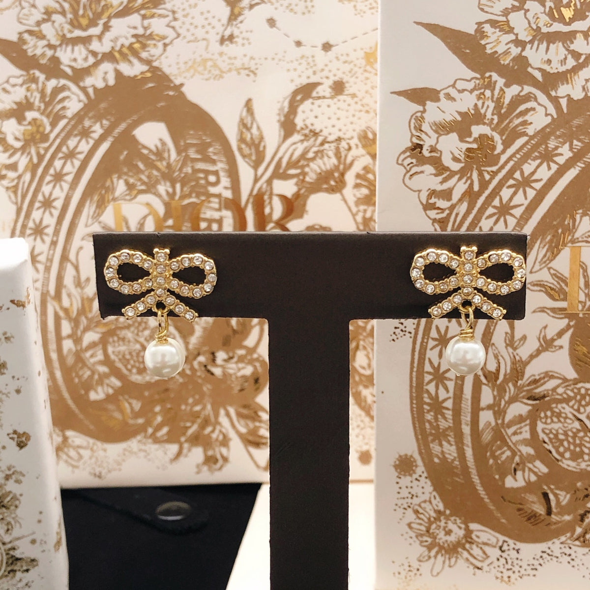 Bow & Butterfly Motif Stud Earrings in Polished Metal-Tone with Pearl-Style Detail main product view
