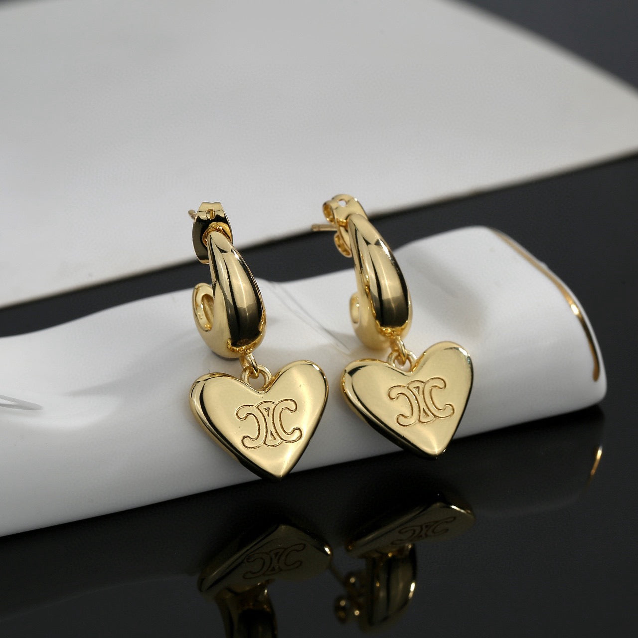 Signature Emblem Stud Earrings in Gold-Tone – Design 08 styled detail