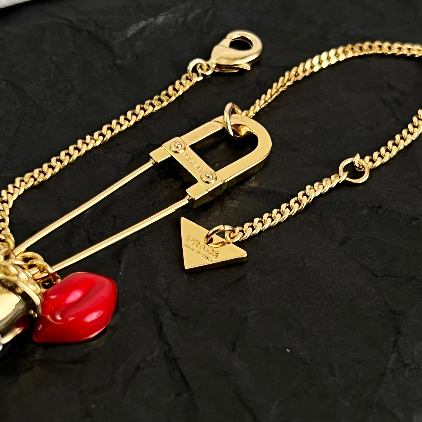 Signature Emblem Bracelet in Polished Metal-Tone front view