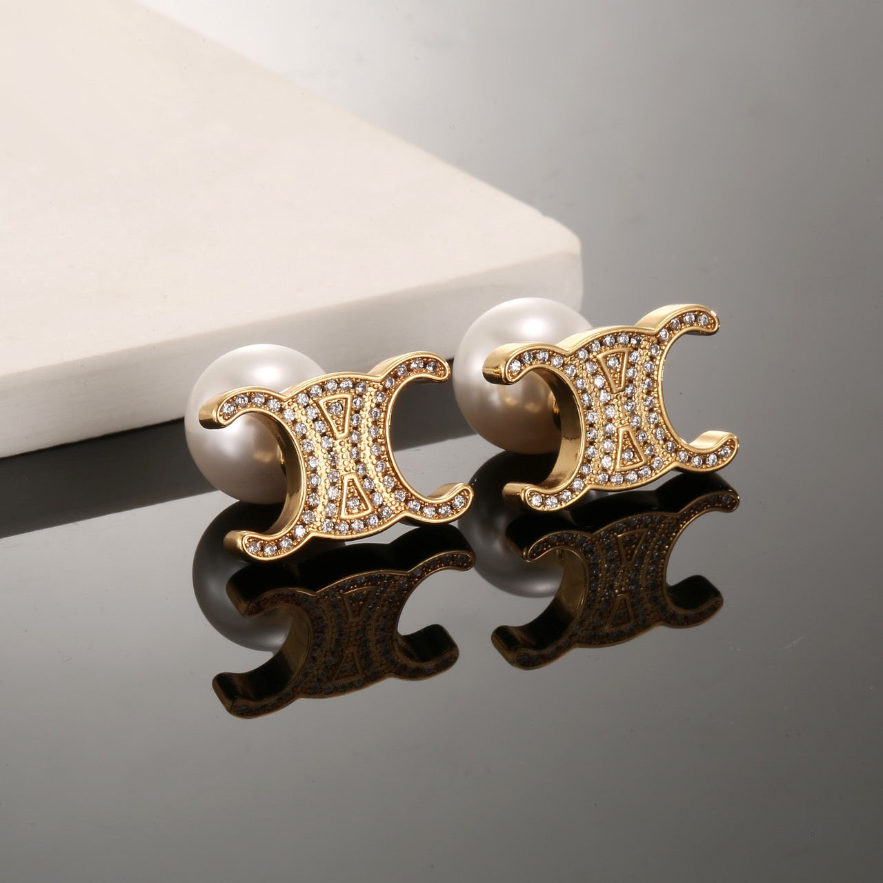 Signature Emblem Stud Earrings in Gold-Tone – Design 01 styled detail
