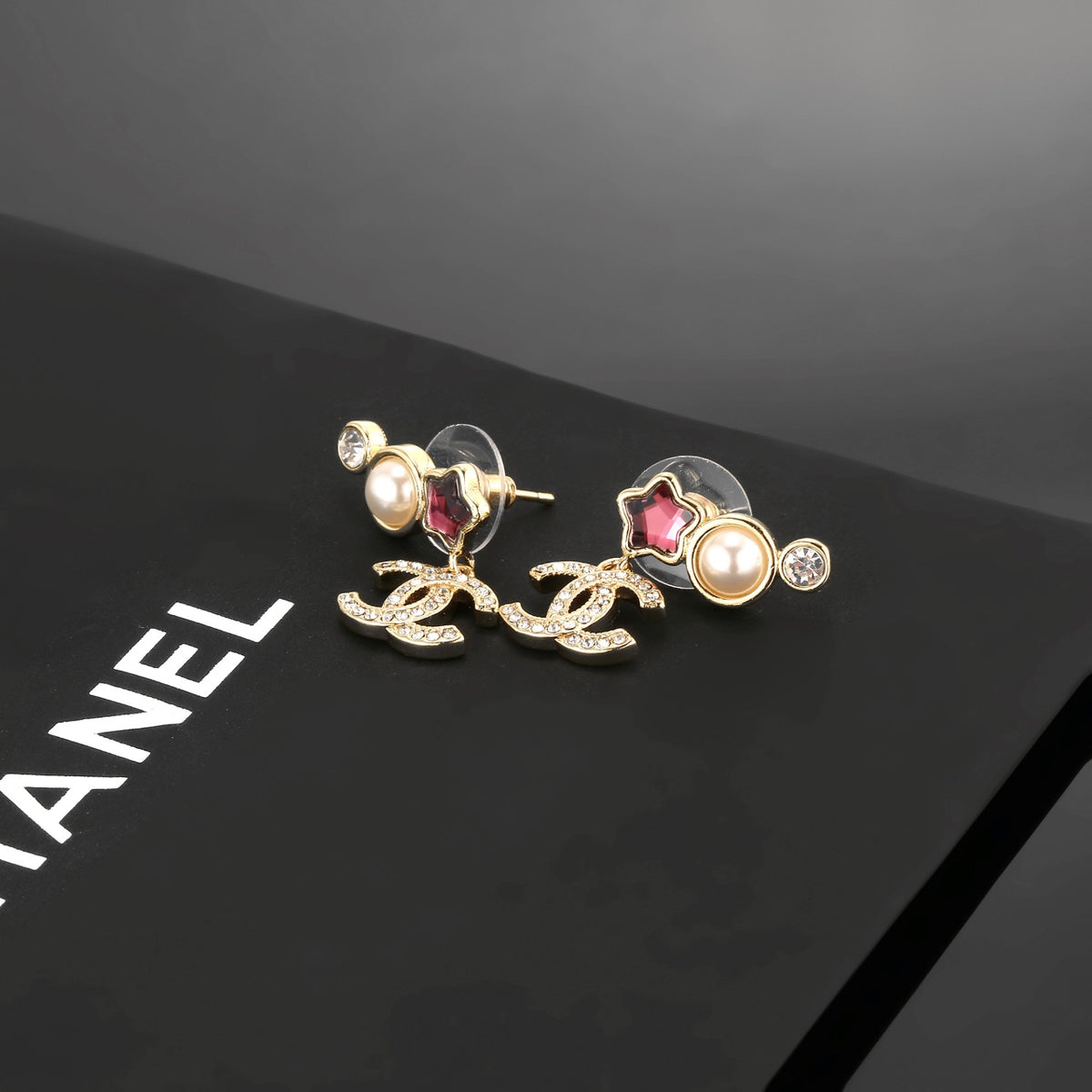 Double-C Emblem Stud Earrings in Gold-Tone – Star Detail – Design 003 styled product view