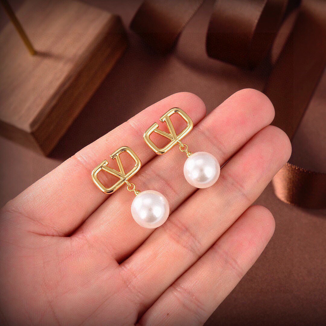 Signature Emblem Stud Earrings in Gold-Tone – Design 17 styled detail