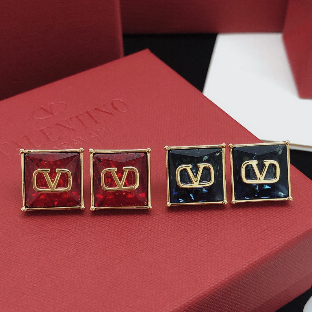 Signature Emblem Stud Earrings in Polished Metal-Tone – Red detail view