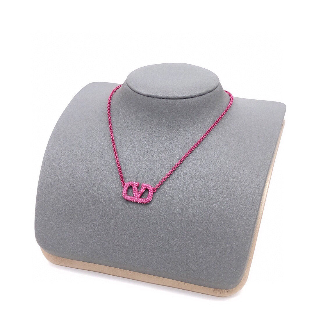 Signature Emblem Crystal-Accent Pendant Necklace – Purple – Design 02 styled detail