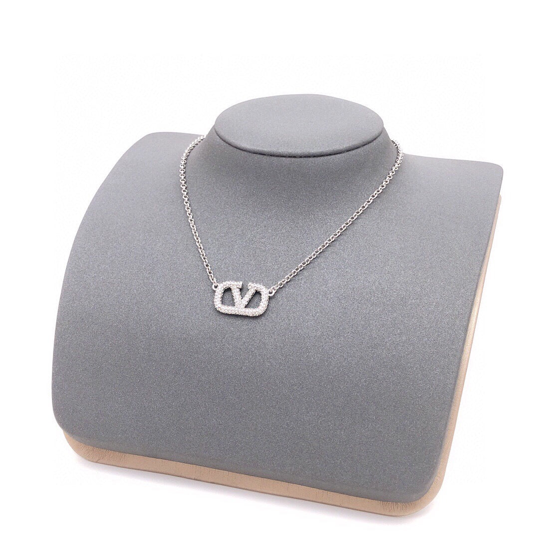 Signature Emblem Crystal-Accent Pendant Necklace – Design 02 styled detail