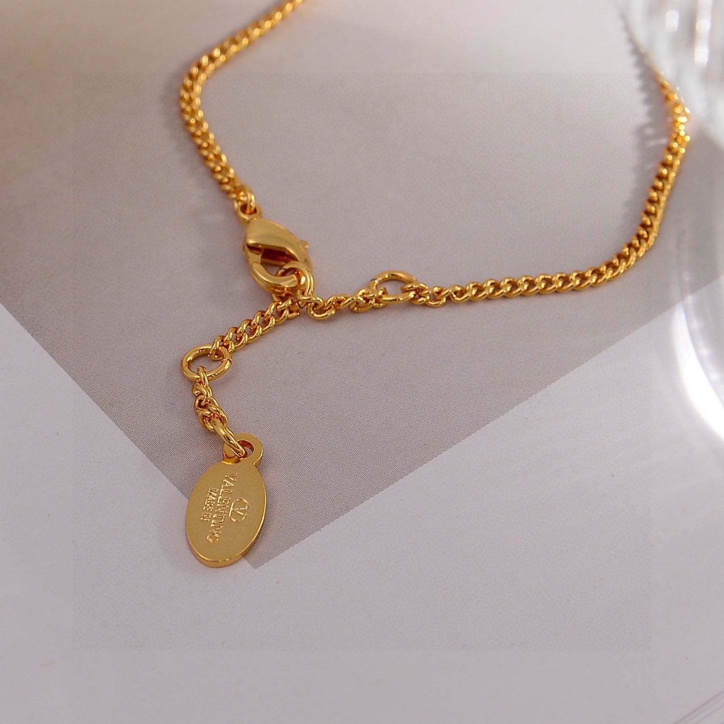 Signature Emblem Bracelet in Gold-Tone – Design 01 close-up view