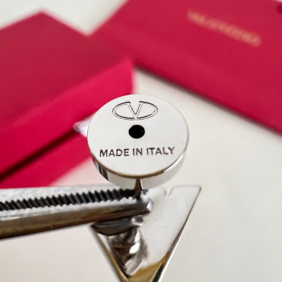 Signature Emblem Stud Earrings in Polished Metal-Tone – Design 02 styled detail