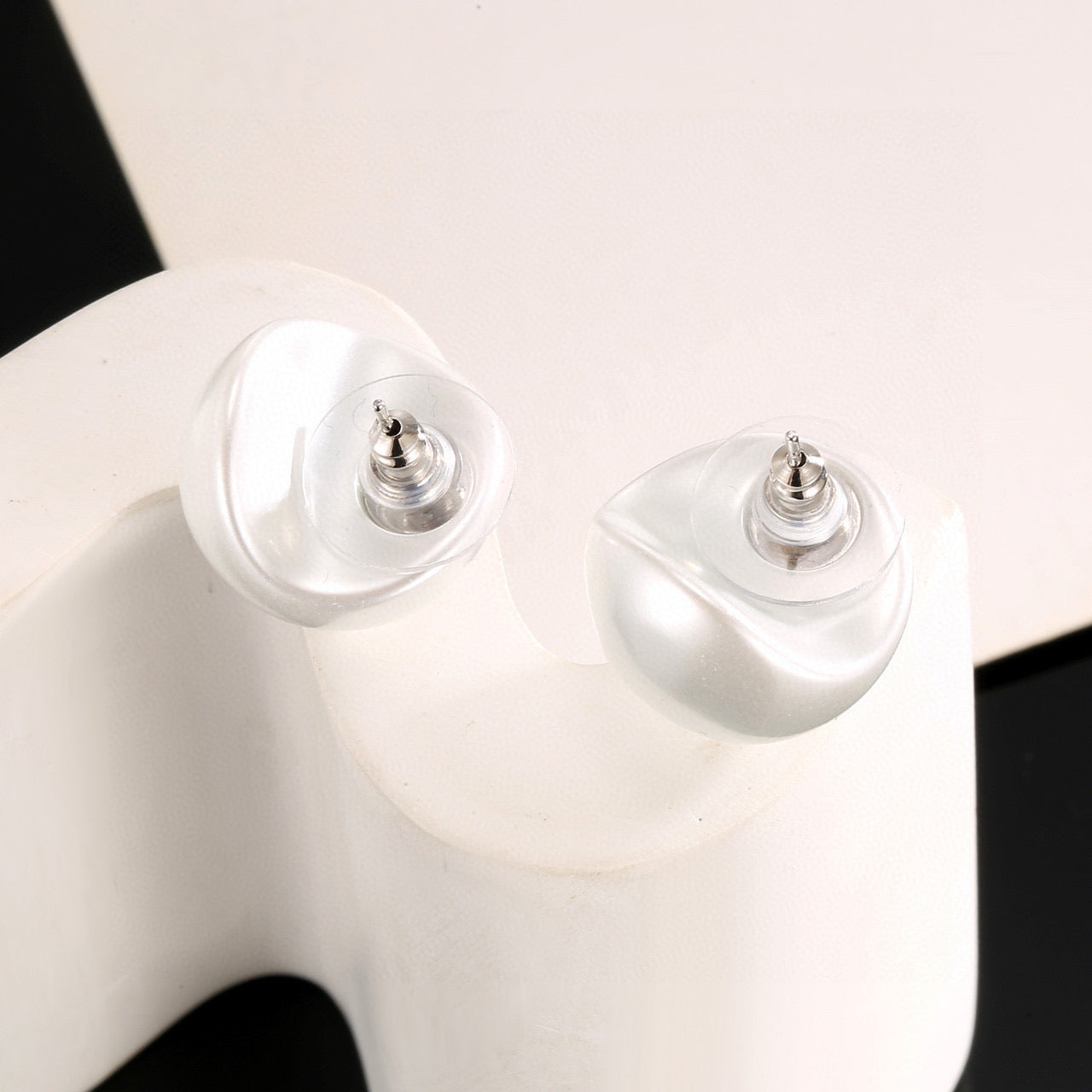Double-C Emblem Stud Earrings in Polished Metal-Tone – White Detail main product view
