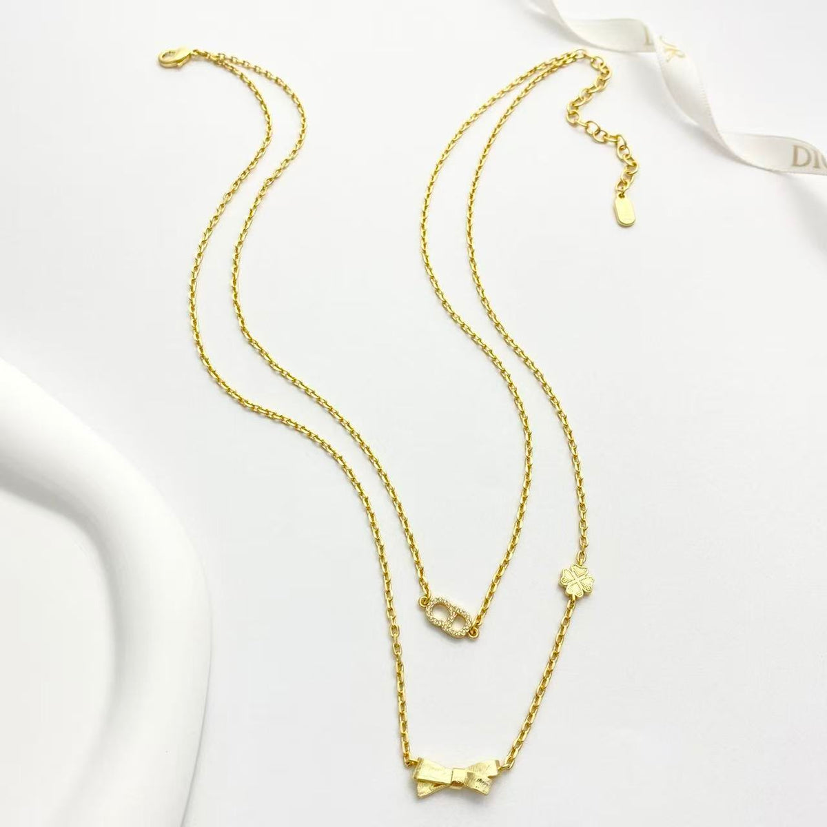 Bow & Butterfly Motif Pendant Necklace in Polished Metal-Tone with Layered Detail – Design 002 front view