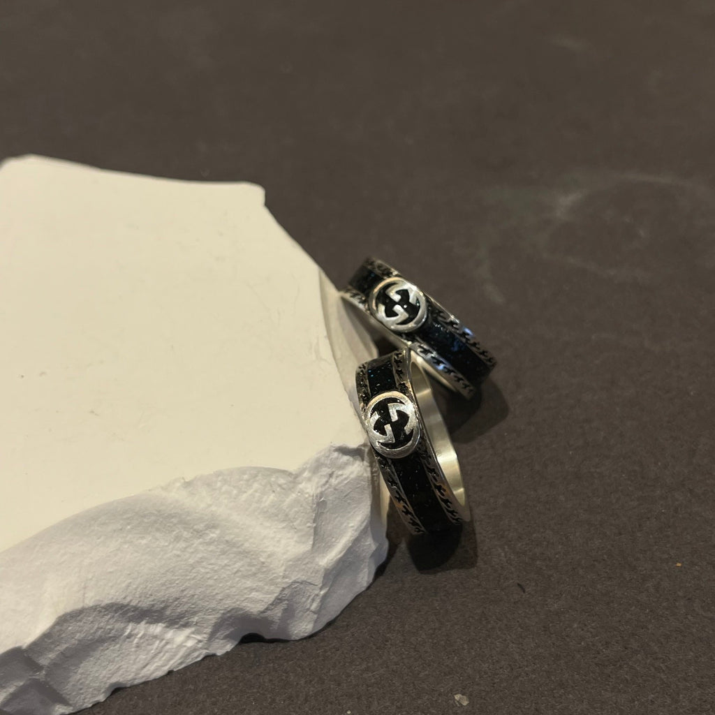 Double-G Emblem Statement Ring in Polished Metal-Tone – Vintage Detail close-up detail