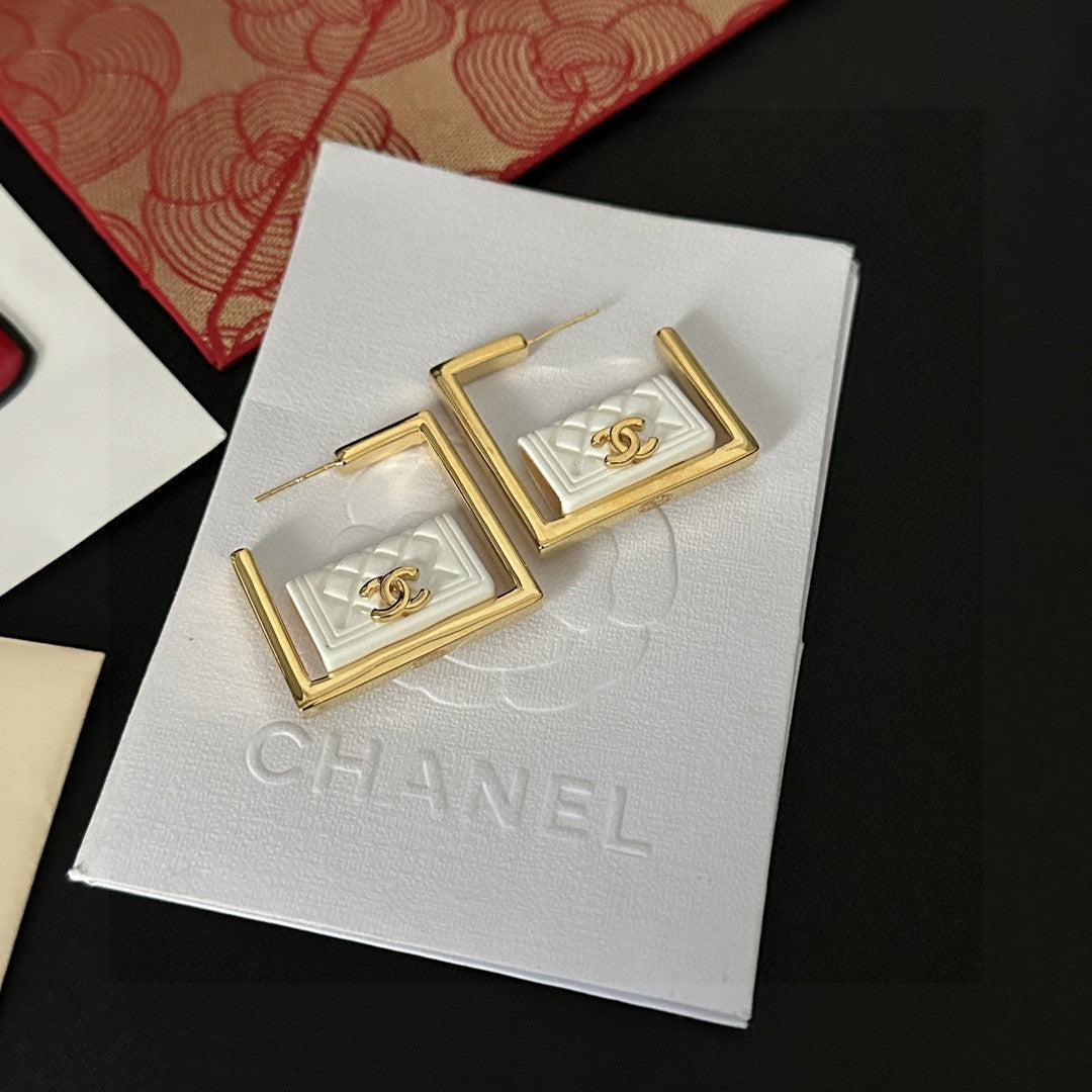 Double-C Emblem Stud Earrings in Polished Metal-Tone – Design 111 close-up detail