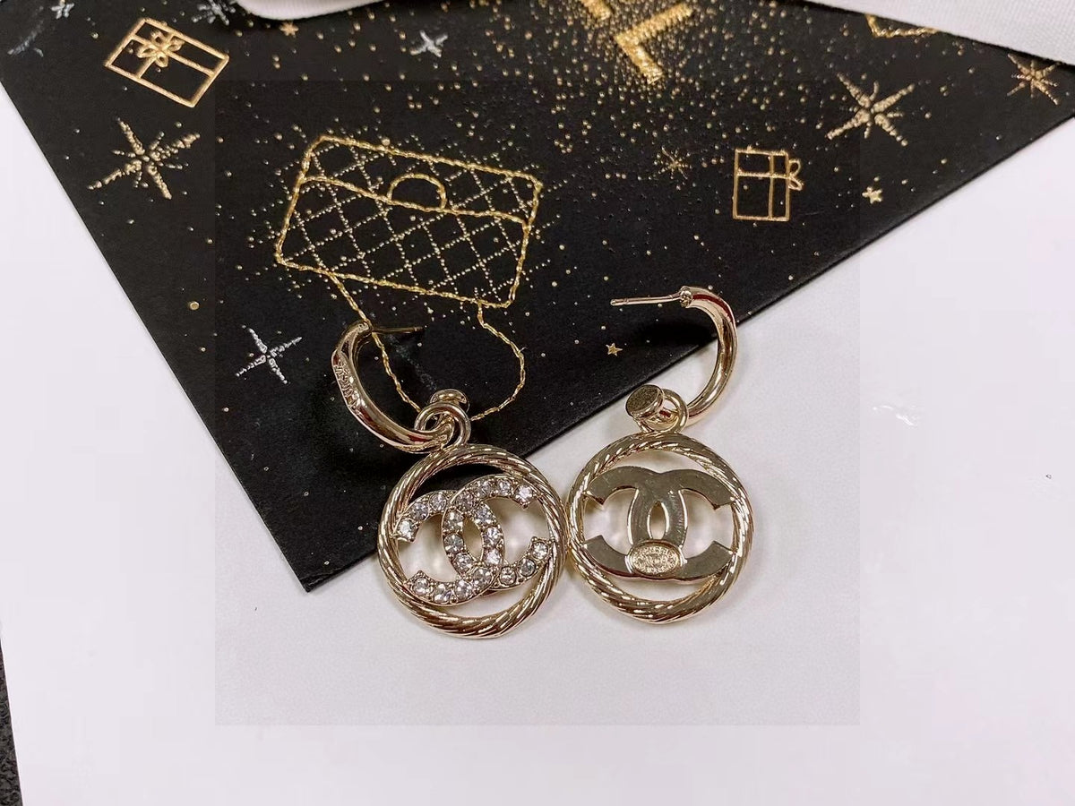 Double-C Emblem Stud Earrings in Polished Metal-Tone – Design 110 detail view