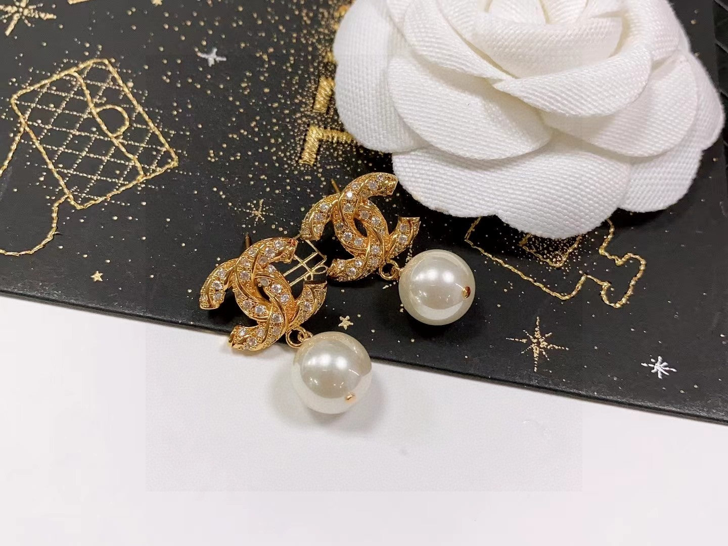 Double-C Emblem Stud Earrings in Polished Metal-Tone – Design 481 close-up detail
