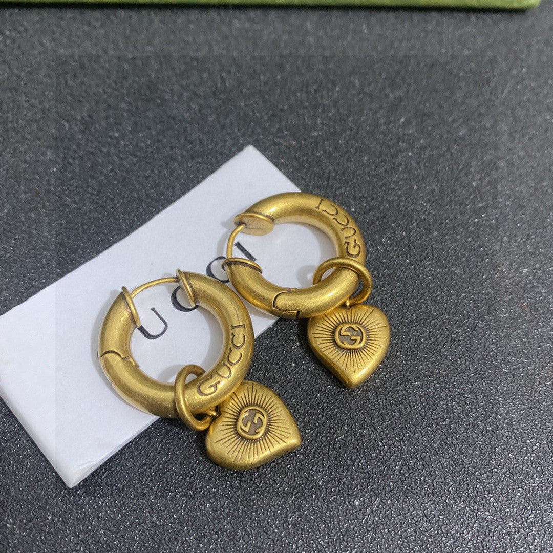 Letter Emblem Stud Earrings in Gold-Tone detail view