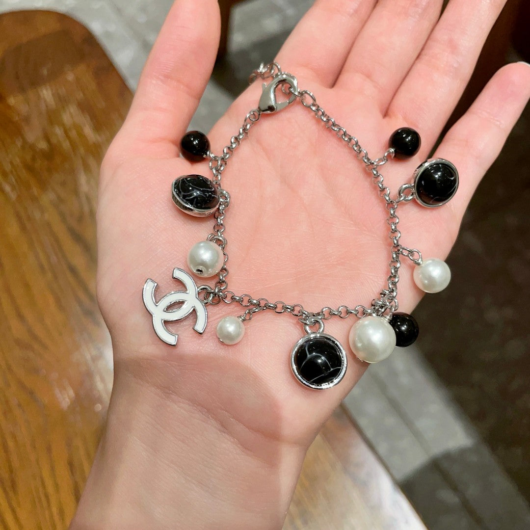 Signature Emblem Bracelet in Polished Metal-Tone – Black Detail – Design 003 detail view