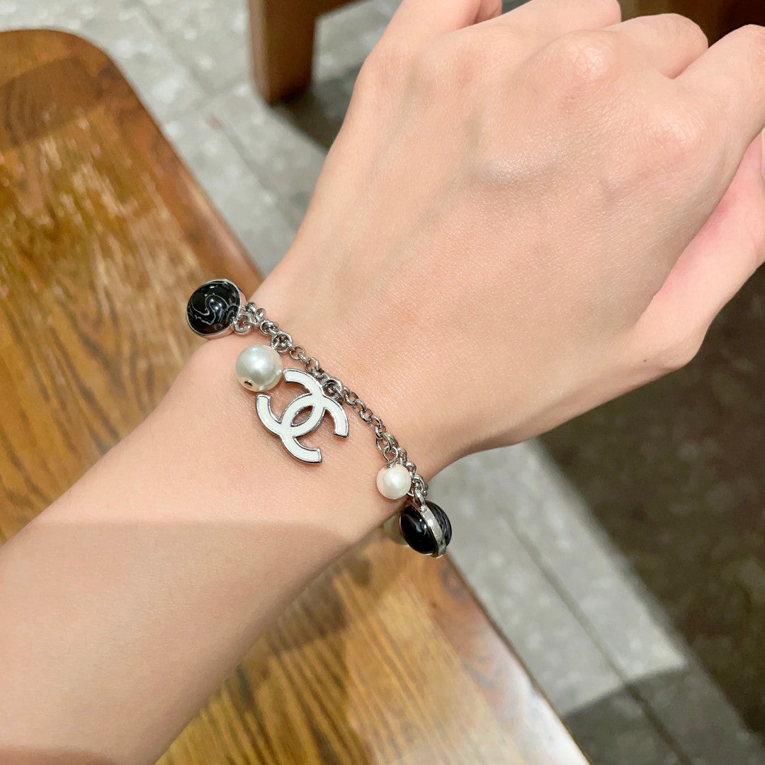 Signature Emblem Bracelet in Polished Metal-Tone – Black Detail – Design 003 front product view