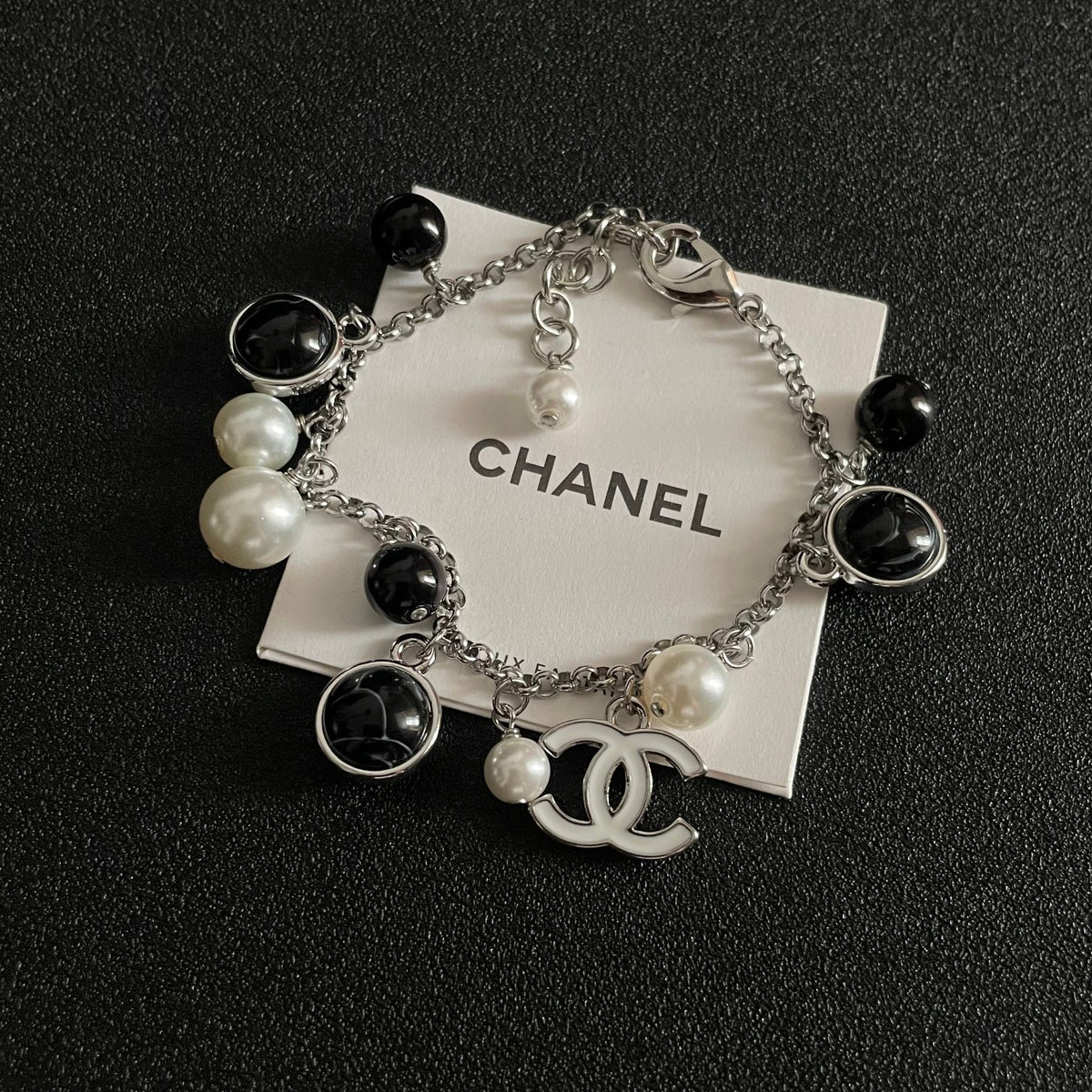 Signature Emblem Bracelet in Polished Metal-Tone – Black Detail – Design 003 styled product view