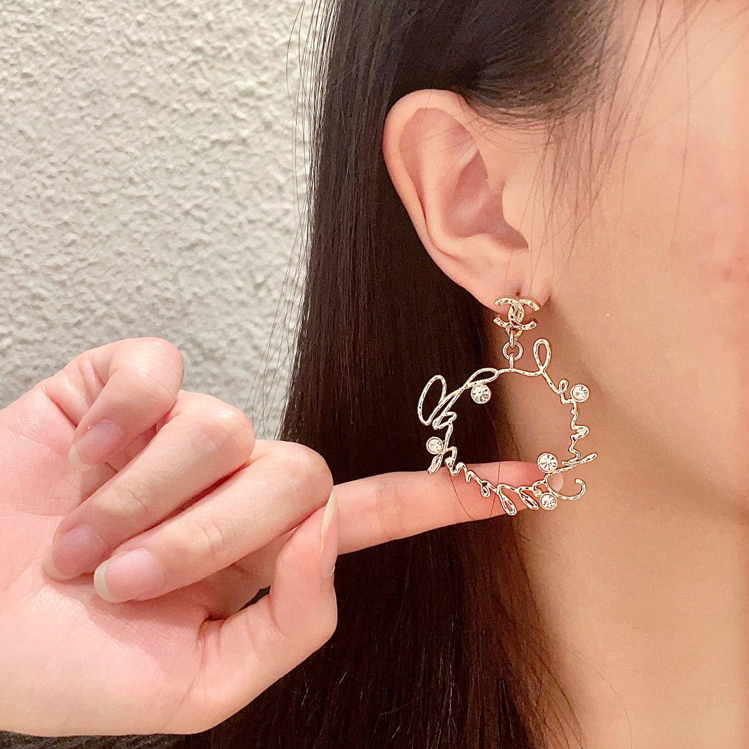 Double-C Emblem Statement Earrings in Polished Metal-Tone – Design 060 detail view