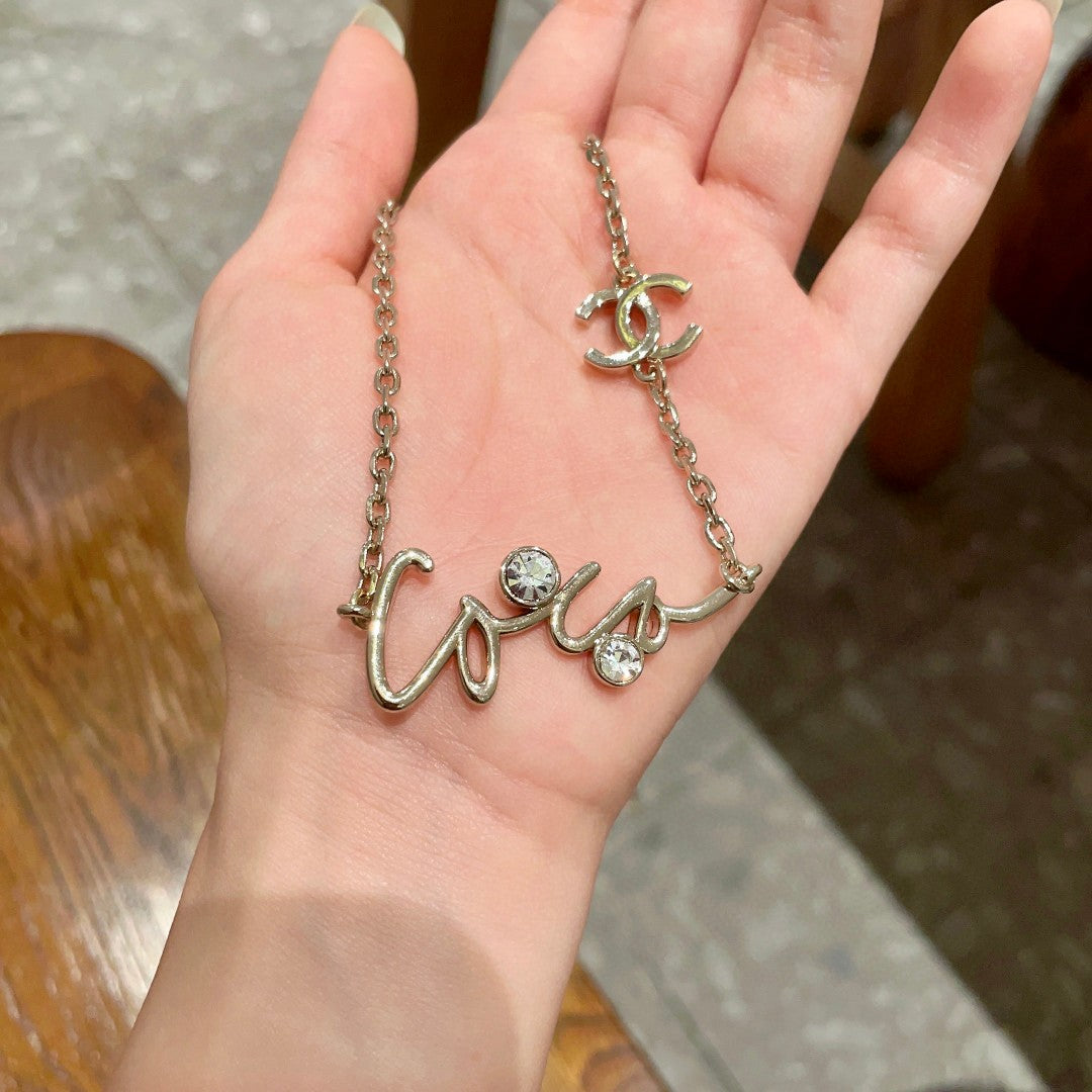 Double-C Emblem Pendant Necklace in Polished Metal-Tone – Design 062 side detail