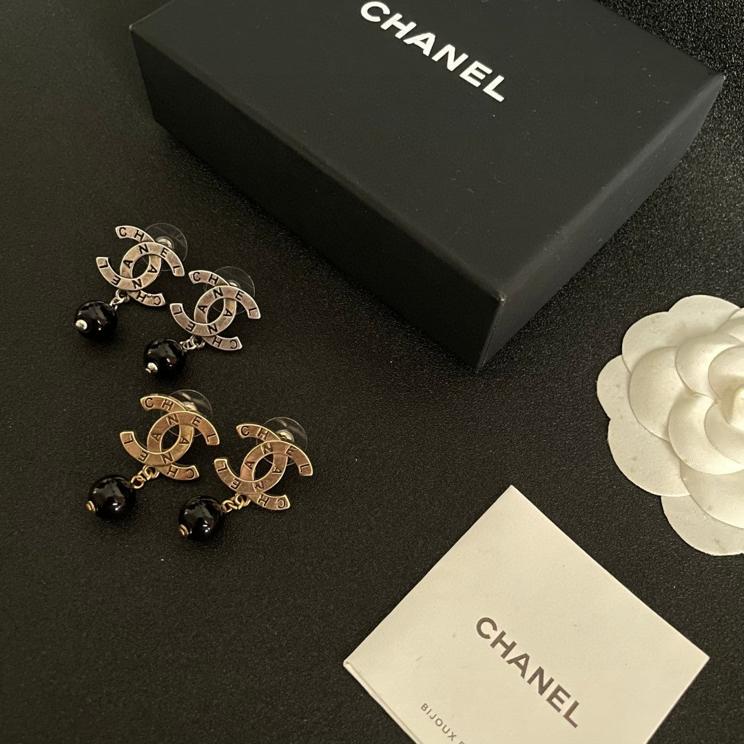 Double-C Emblem Statement Earrings in Polished Metal-Tone – Design 059 close-up detail