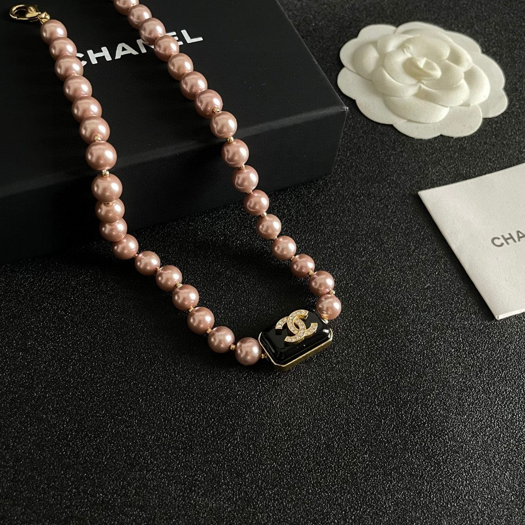Double-C Emblem Pearl-Detail Pendant Necklace – Pearl Detail – Design 101 styled product view