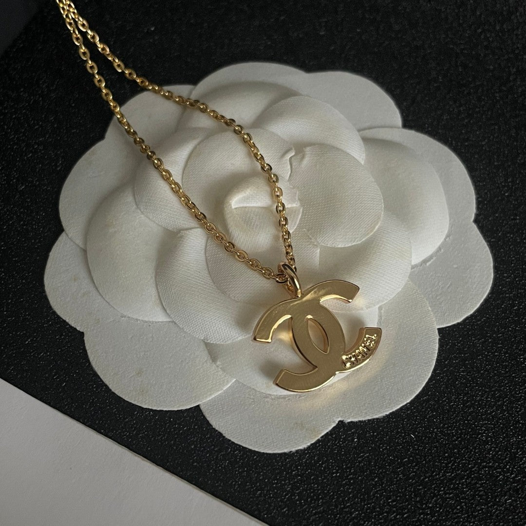 Double-C Emblem Pendant Necklace in Polished Metal-Tone – Design 058 front product view