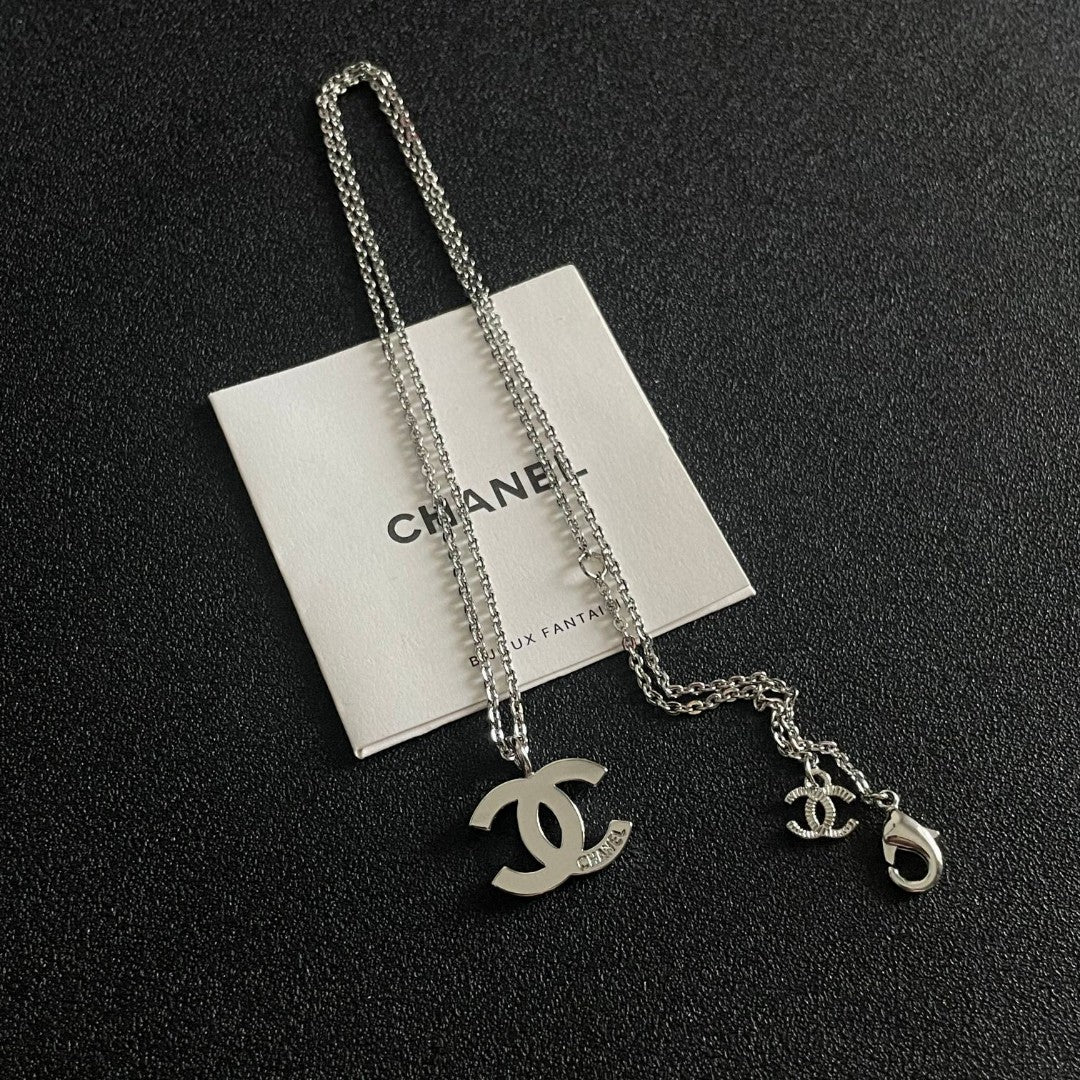 Double-C Emblem Pendant Necklace in Polished Metal-Tone – Design 057 detail view