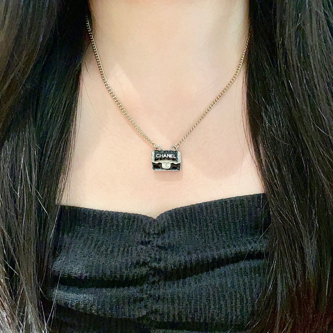 Double-C Emblem Pendant Necklace in Polished Metal-Tone – Design 056 detail view