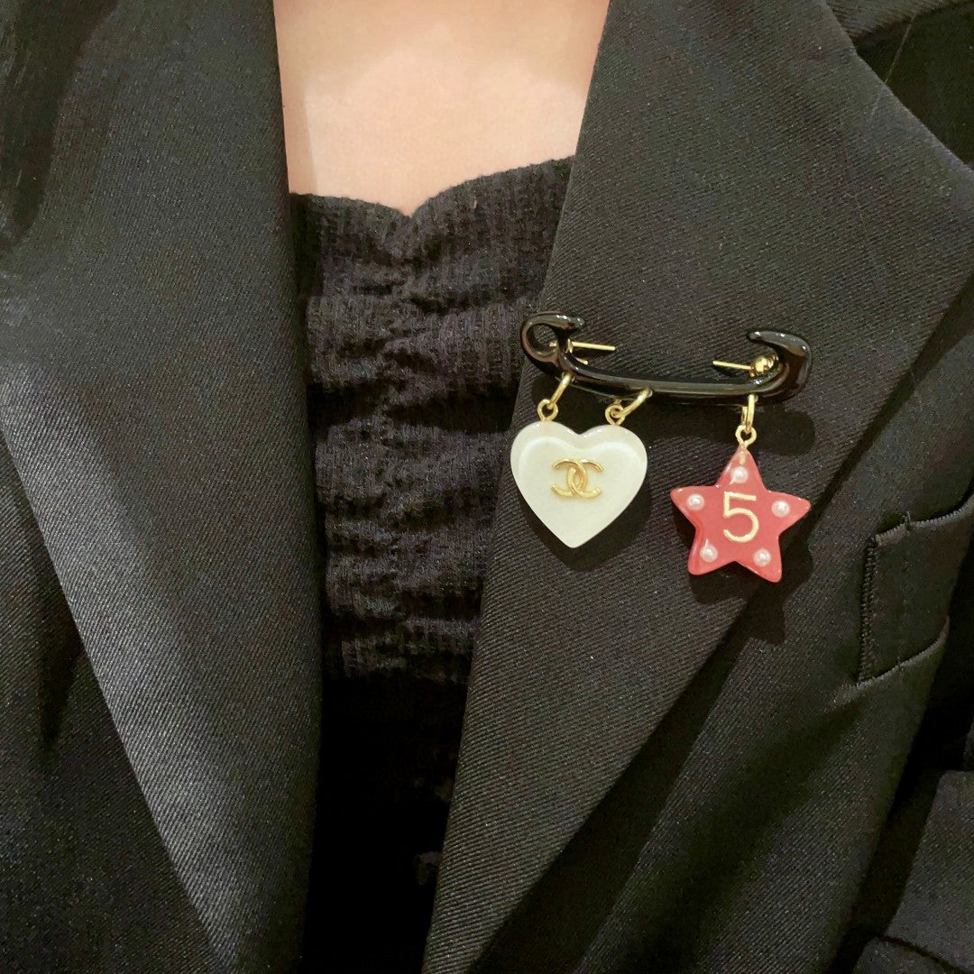 Double-C Emblem Brooch in Polished Metal-Tone – Star Detail front product view