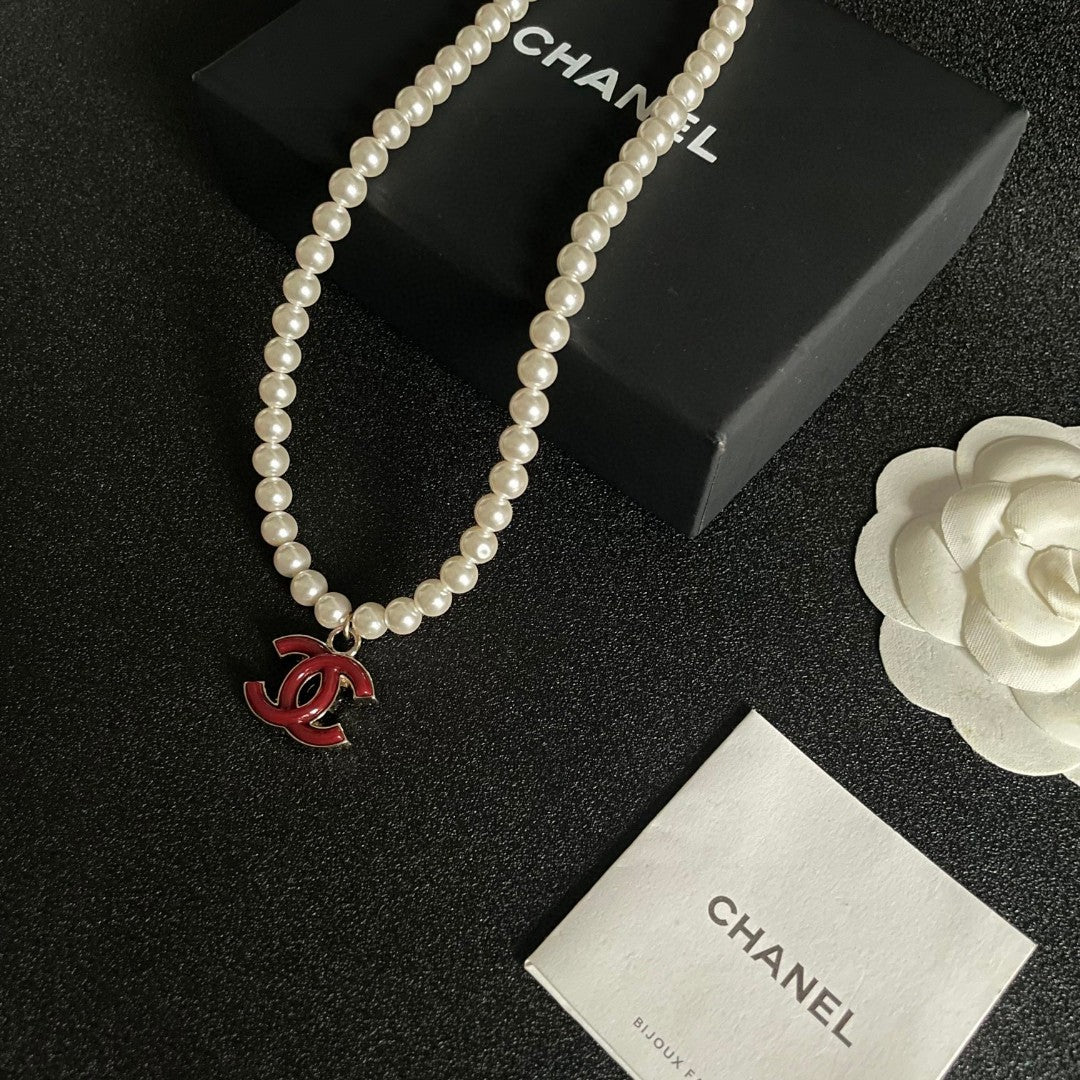 Double-C Emblem Pearl-Detail Pendant Necklace – Pearl Detail – Design 084 styled product view