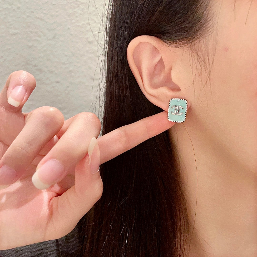 Double-C Emblem Stud Earrings in Polished Metal-Tone – Design 307 front product view