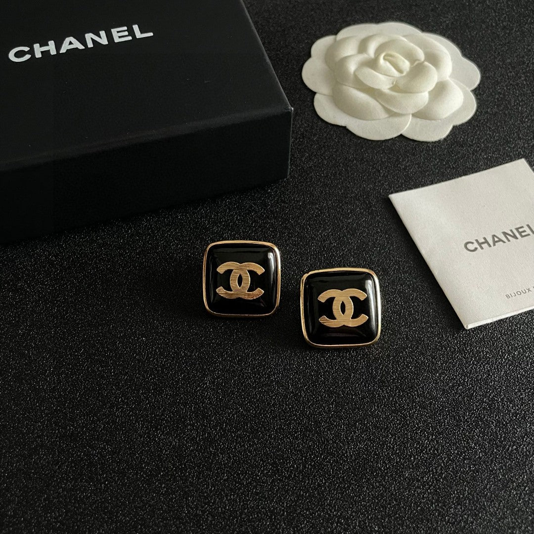 Double-C Emblem Stud Earrings in Polished Metal-Tone – Design 295 styled product view