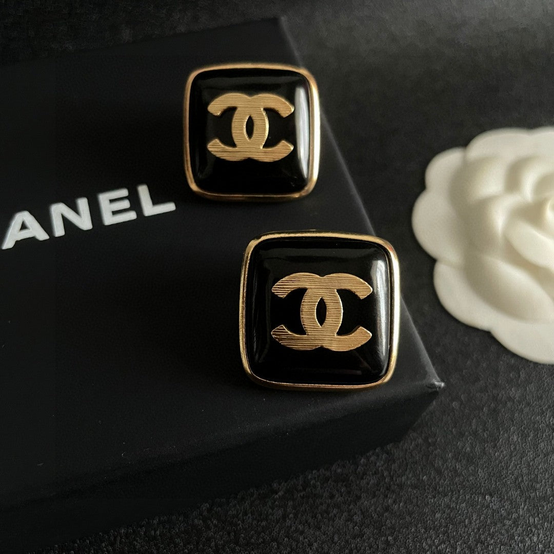 Double-C Emblem Stud Earrings in Polished Metal-Tone – Design 295 detail view