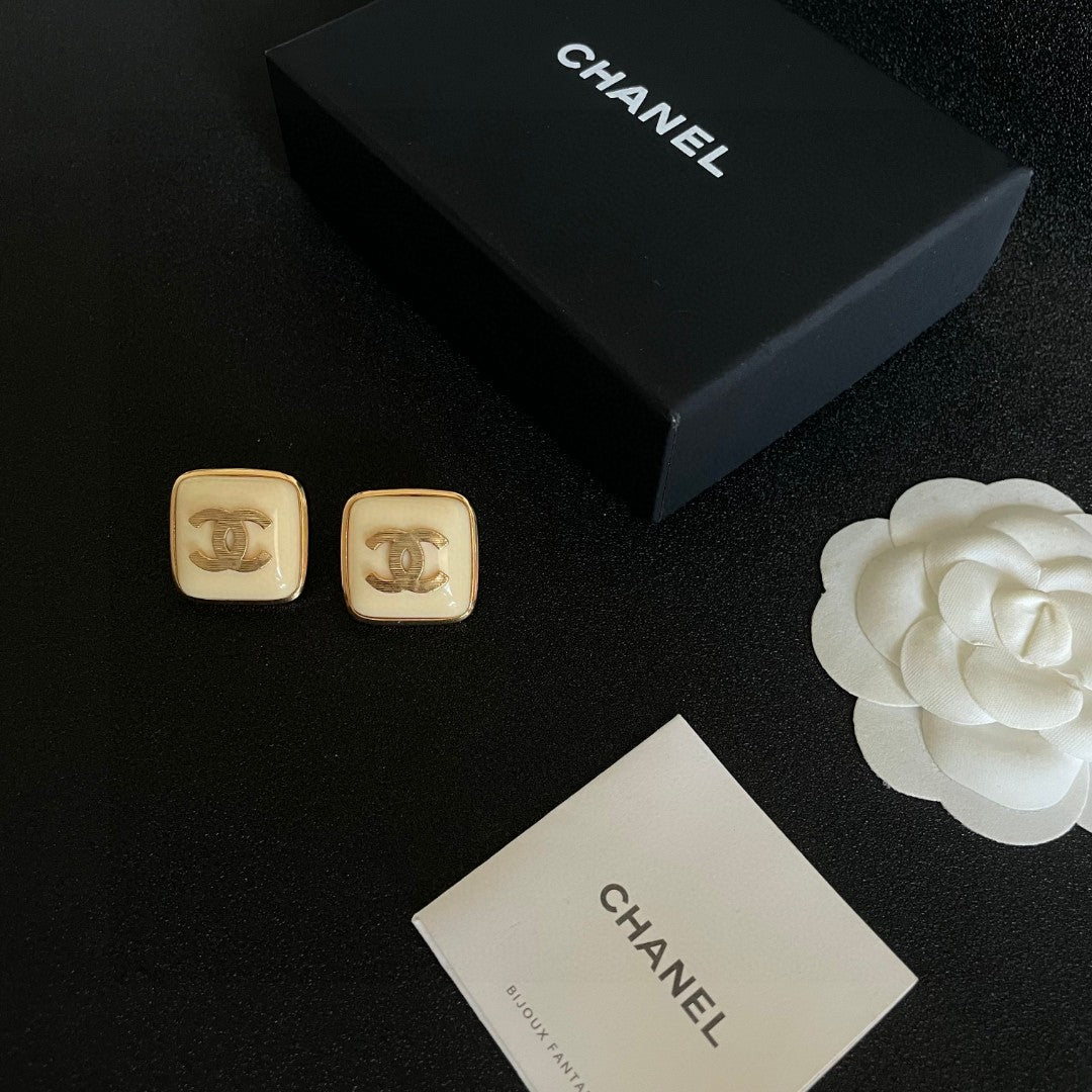 Double-C Emblem Stud Earrings in Polished Metal-Tone – Design 294 close-up detail