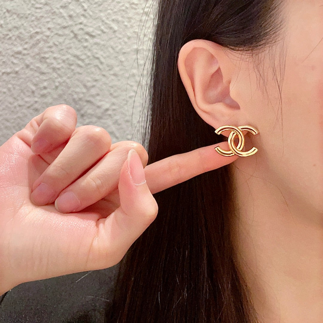 Double-C Emblem Stud Earrings in Polished Metal-Tone – Design 263 front product view