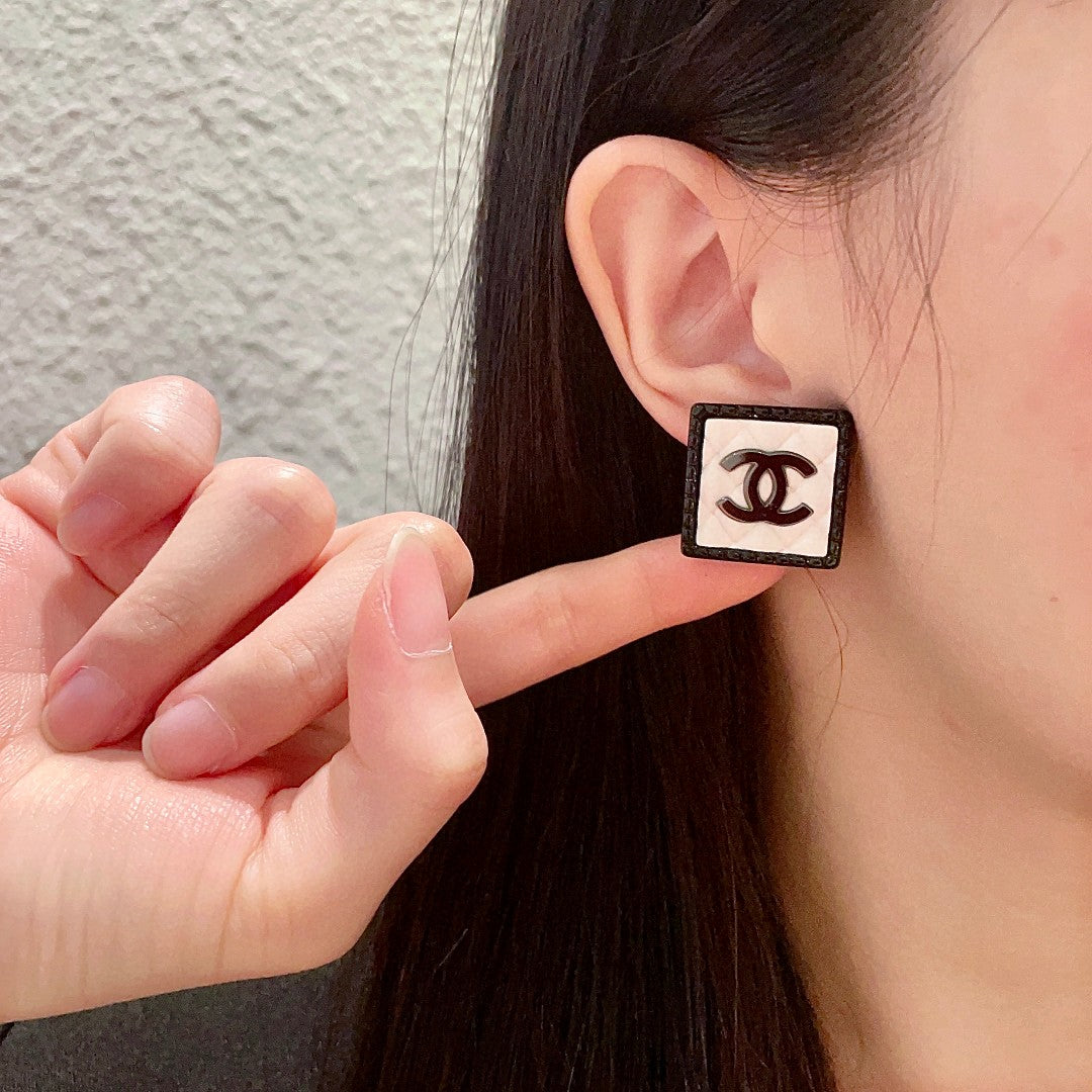Double-C Emblem Stud Earrings in Polished Metal-Tone – Design 228 front product view