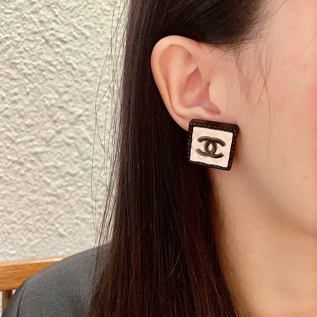 Double-C Emblem Stud Earrings in Polished Metal-Tone – Design 228 detail view