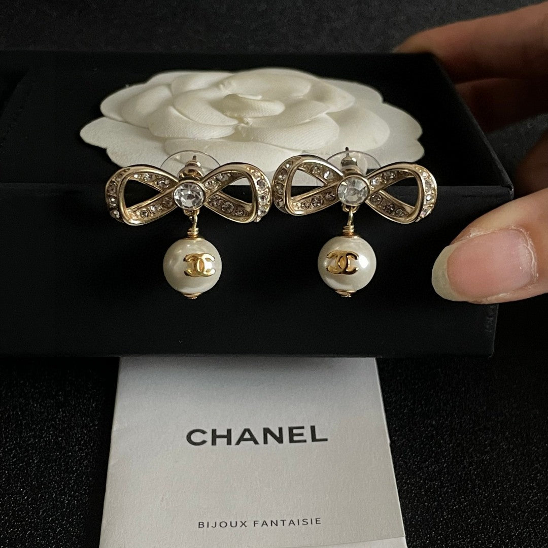Bow Pearl-Detail Statement Earrings close-up detail