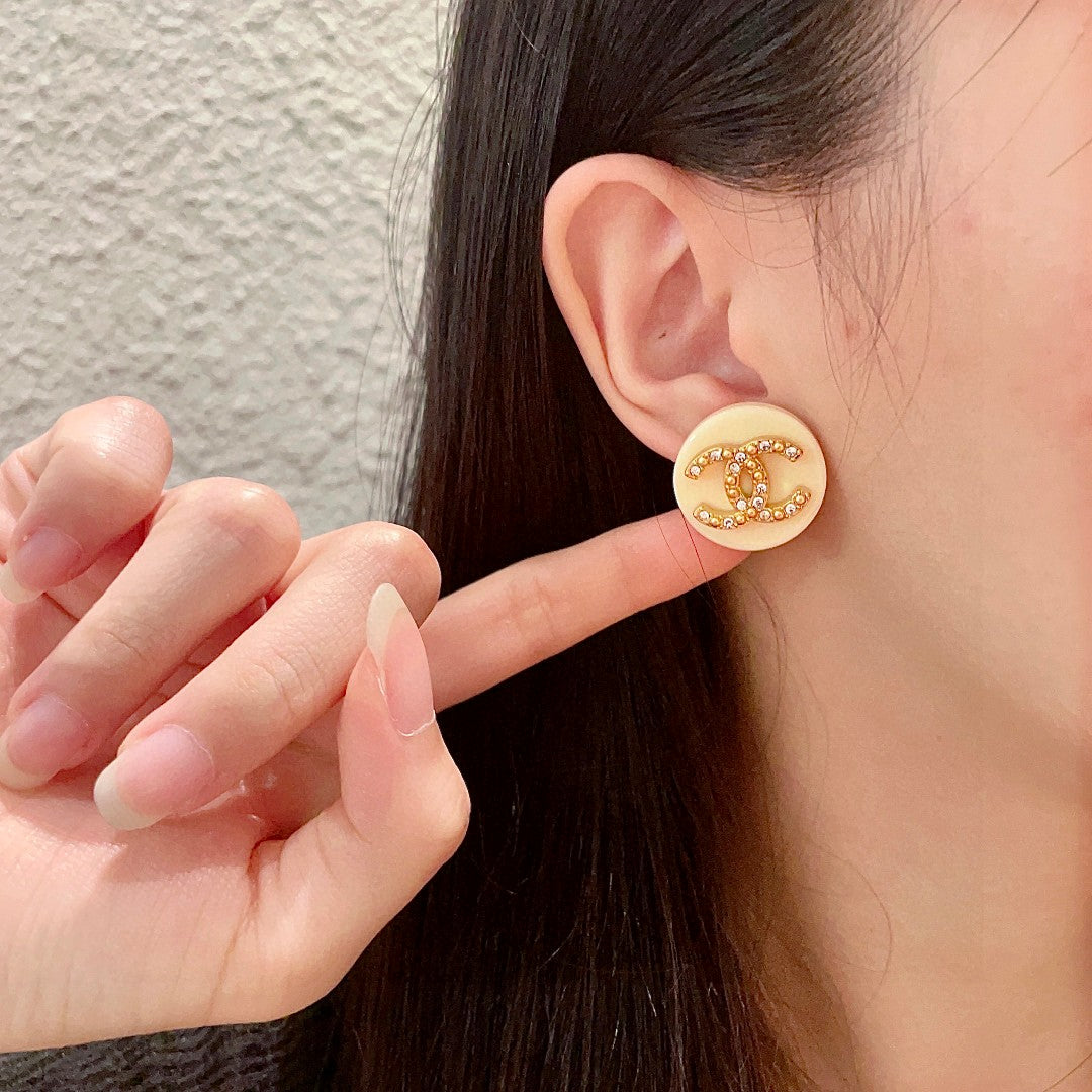 Double-C Emblem Stud Earrings in Polished Metal-Tone – Design 220 front product view