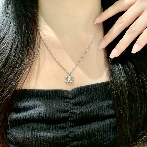 Double-C Emblem Pendant Necklace in Polished Metal-Tone – Design 025 main product view