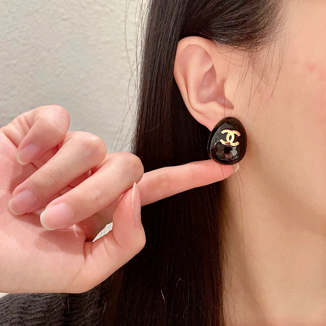 Double-C Emblem Stud Earrings in Polished Metal-Tone – Design 193 front product view