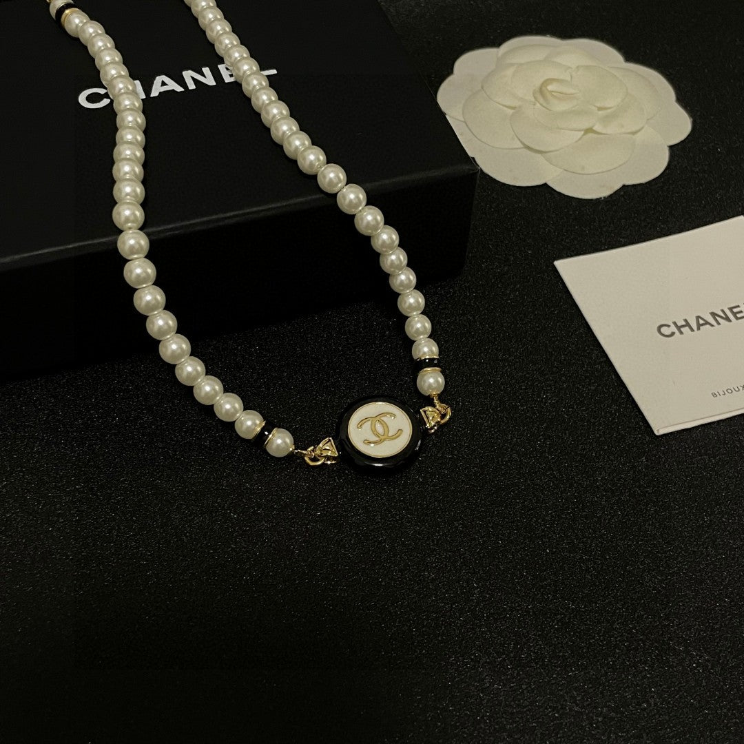 Double-C Emblem Pearl-Detail Pendant Necklace – Pearl Detail – Design 046 styled product view