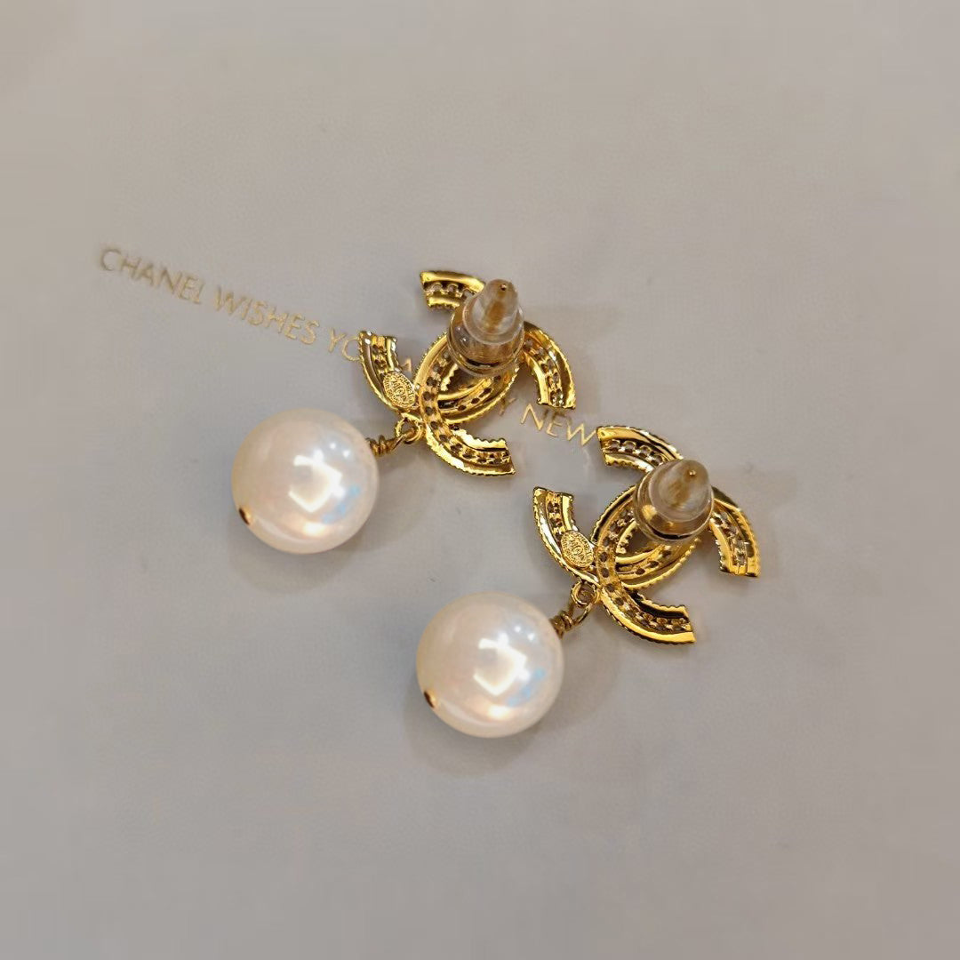 Letter Pearl-Detail Stud Earrings – Pearl Detail close-up detail